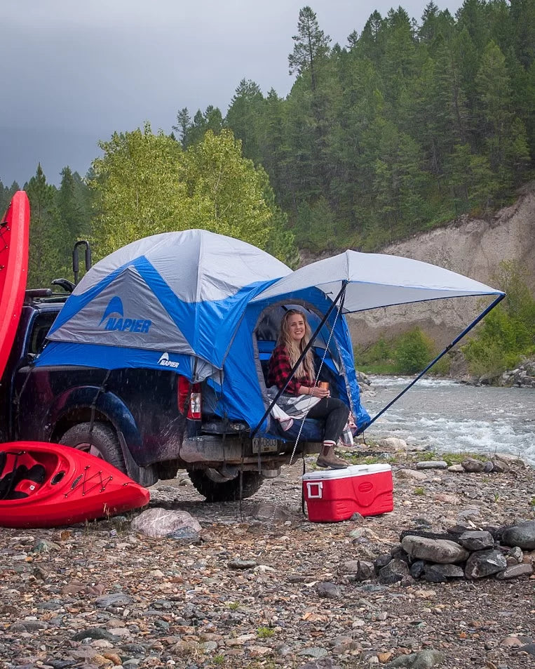 Napier Outdoors Sportz Truck Tent 57 Series Blue and Grey with Awning on a truck in the rain
